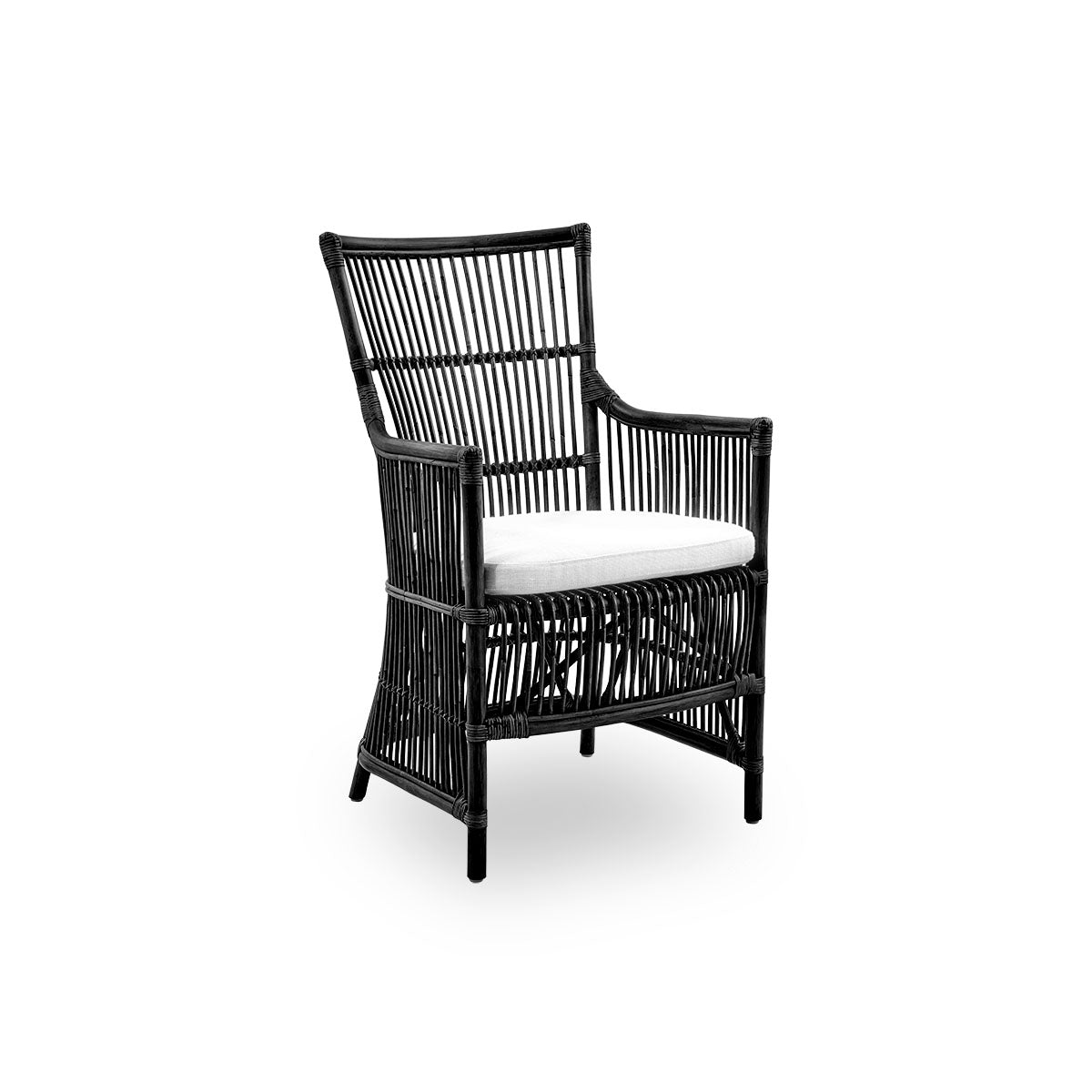 Side view of the Davinci dining chair in black color. A wicker chair with armrests and a high back, handcrafted from high-quality Indonesian rattan.