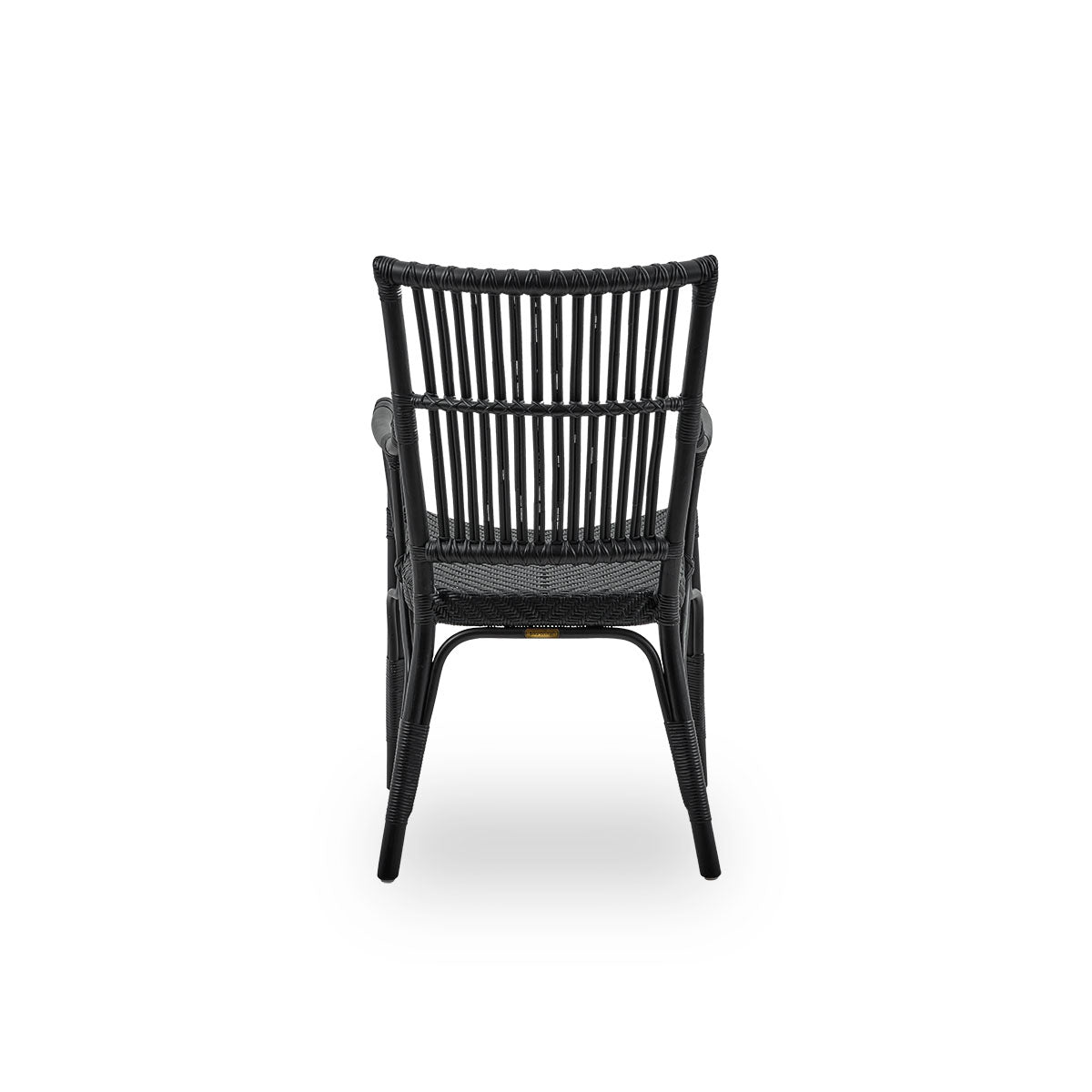Plain back view of Piano armchair in black color. Elegant wicker chair with high backrest and armrests handcrafted from high quality Indonesian rattan.