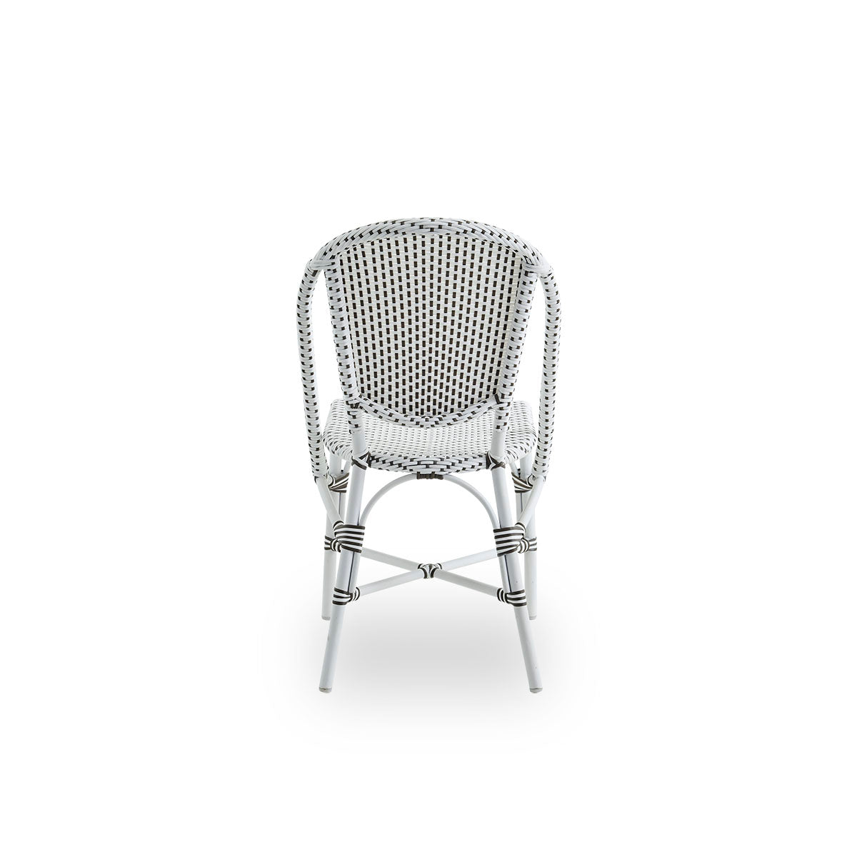 Plain back view of Sofie outdoor dining chair inspired by French café style. Aluminium frame in white color with fully woven seat and backrest handcrafted in ArtFibre in white with brown dots pattern. Stackable outdoor bistro chair.