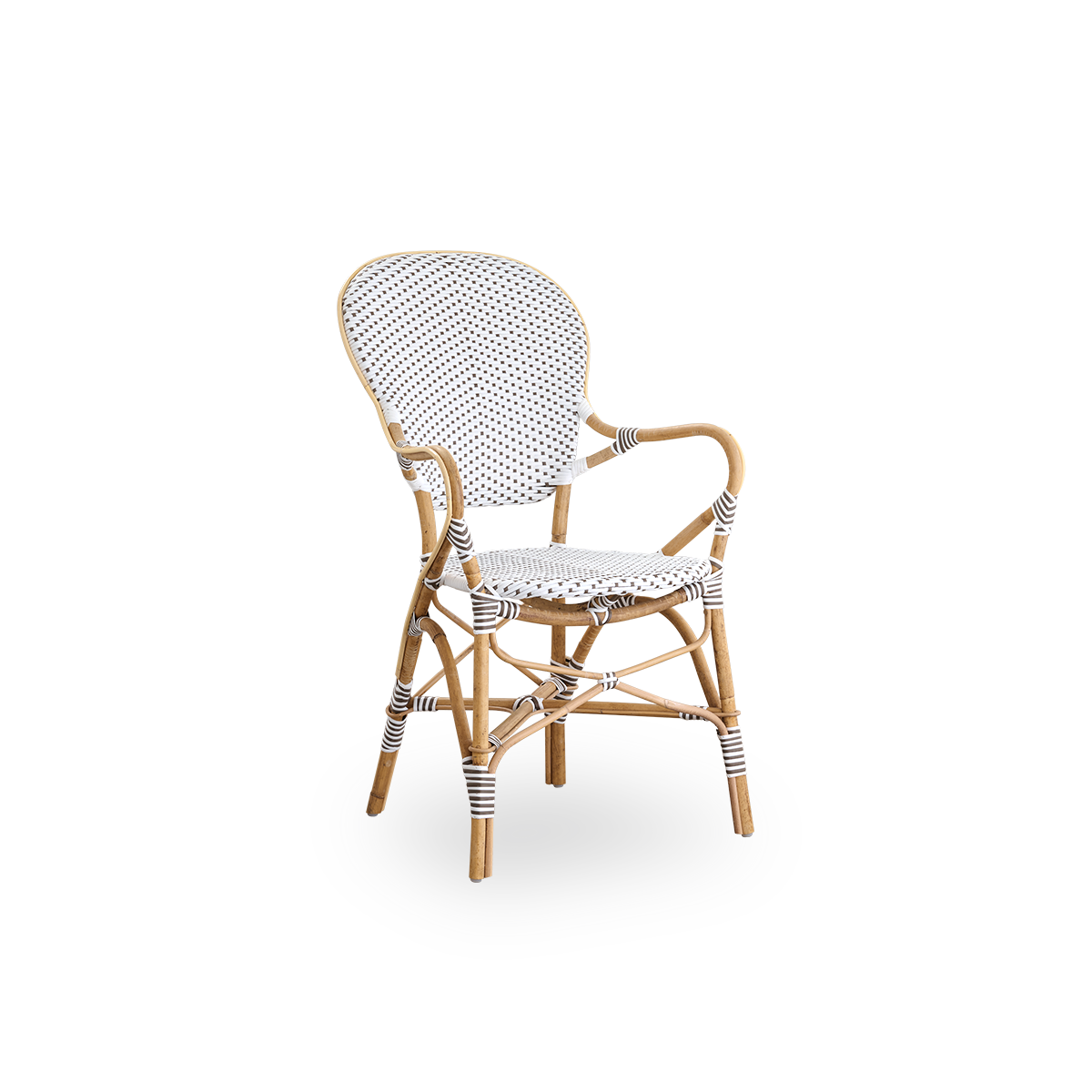Vista lateral de la silla de comedor Isabell con reposabrazos. Estructura de ratán con asiento y respaldo en ArtFibre blanco con puntos marrones. Inspirada en el diseño de bistró de los años 50.