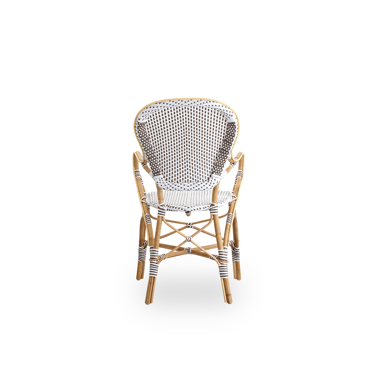 Vista desde atrás de la silla de comedor Isabell con reposabrazos. Estructura de ratán con asiento y respaldo de ArtFibre blanco con puntos marrones. Inspirada en el diseño de bistró de los años 50.