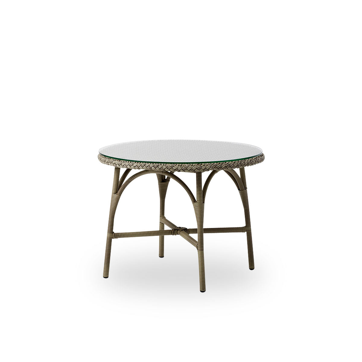 Vista lateral de la mesa de café exterior Victoria redonda con tapa de vidrio Ø80 cm. Estructura de aluminio completamente tejida con ArtFibre en color gris Antique.