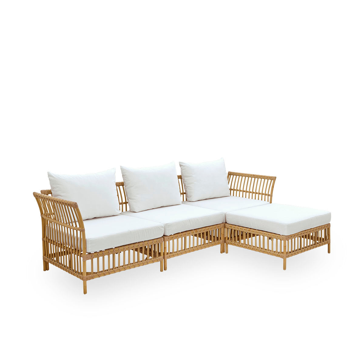 Plain side view of Maggie outdoor sofa corner module in Natural color presented with white seat and back cushion. Aluminium frame with handpainted rattan look with ArtFibre windings.
